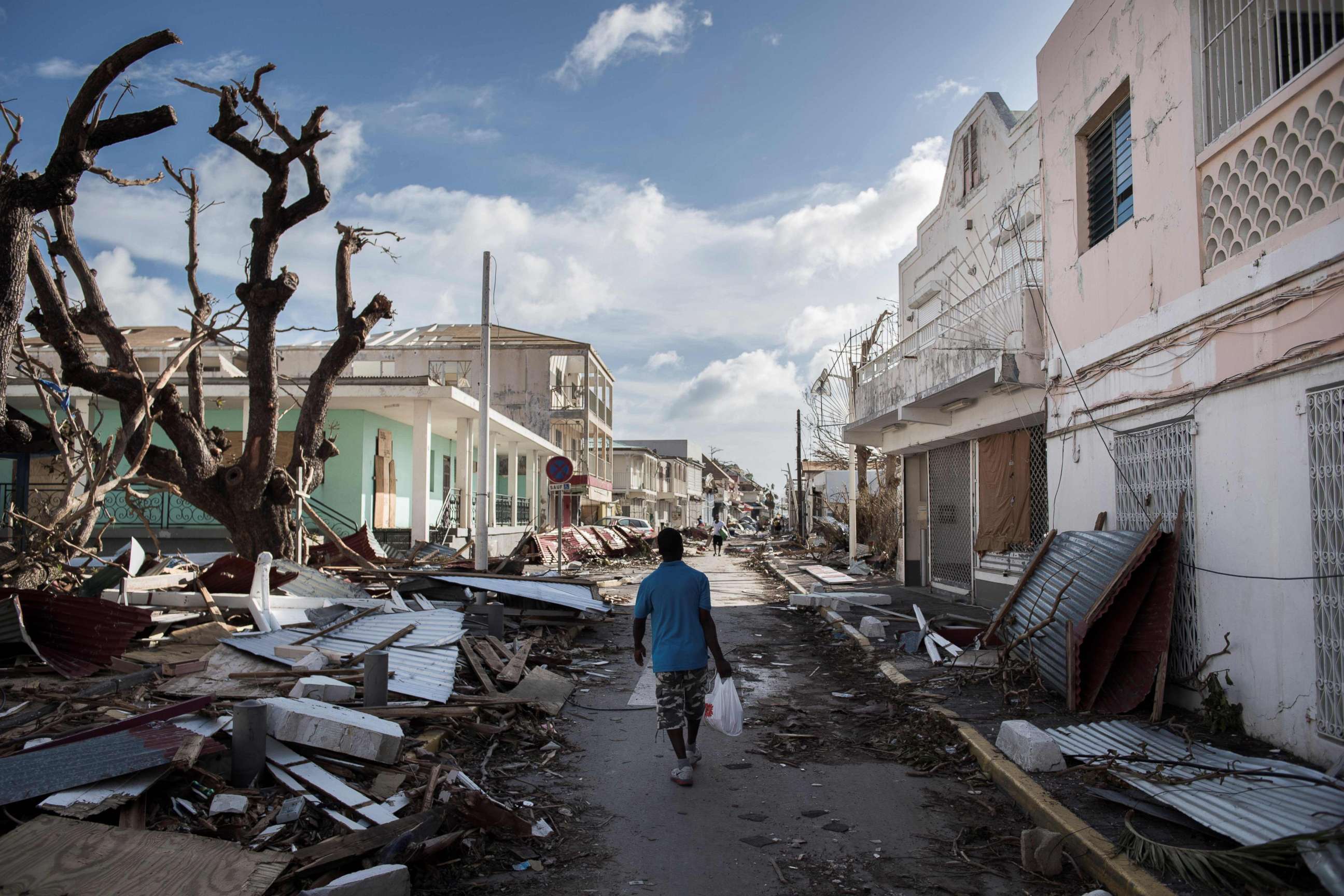 PHOTO: A man walks on a street covered in debris after hurricane Irma hurricane passed on the French island of Saint-Martin, near Marigot, Sept. 8, 2017. 