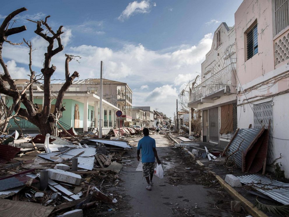 PHOTO: A man walks on a street covered in debris after hurricane Irma hurricane passed on the French island of Saint-Martin, near Marigot, Sept. 8, 2017.