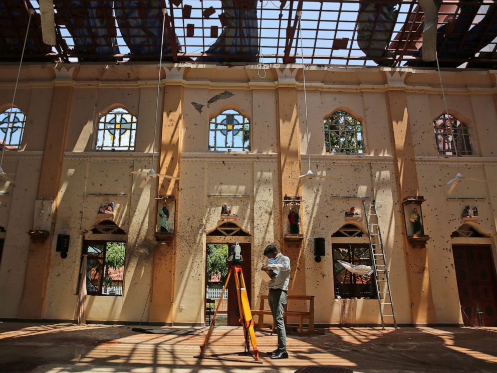 PHOTO: Sunlight steams in from gaping holes, as a surveyor works at St. Sebastians Church, where a suicide bomber blew himself up on Easter Sunday in Negombo, north of Colombo, Sri Lanka, April 25, 2019.