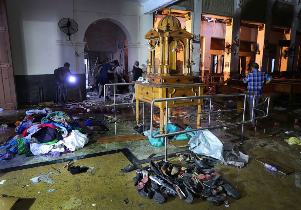 PHOTO: Shoes and other belongings left by panicked worshippers are seen stacked up inside St. Anthony's Church in Colombo, Sri Lanka, Friday, April 26, 2019.