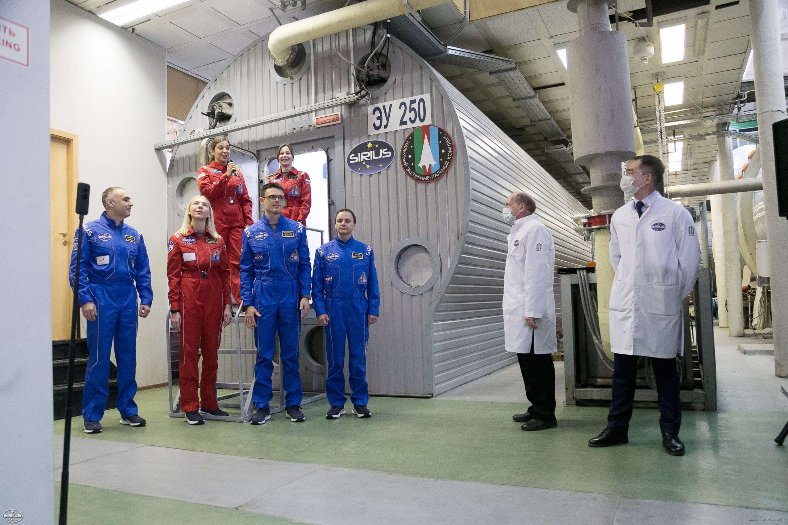PHOTO: The SIRIUS-19 participants stand next to the habitat at Moscow's Institute of Biomedical Problems where they will spend the next 4 months locked inside.