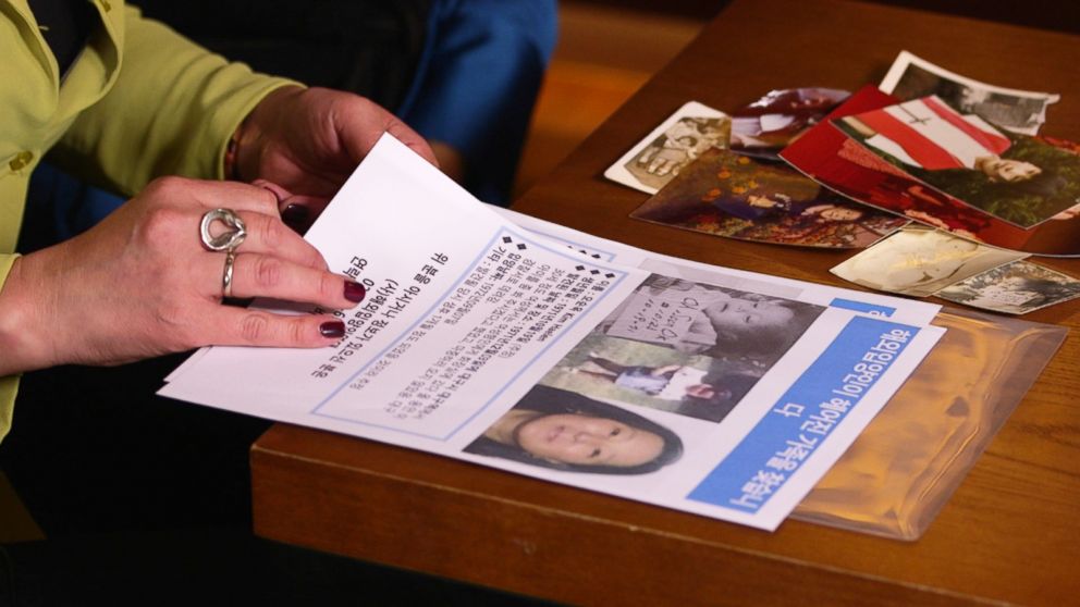 PHOTO: Christine Pennell and Kim Haelen distributed flyers in Daegu, South Korea hoping to find trace of their biological parents.