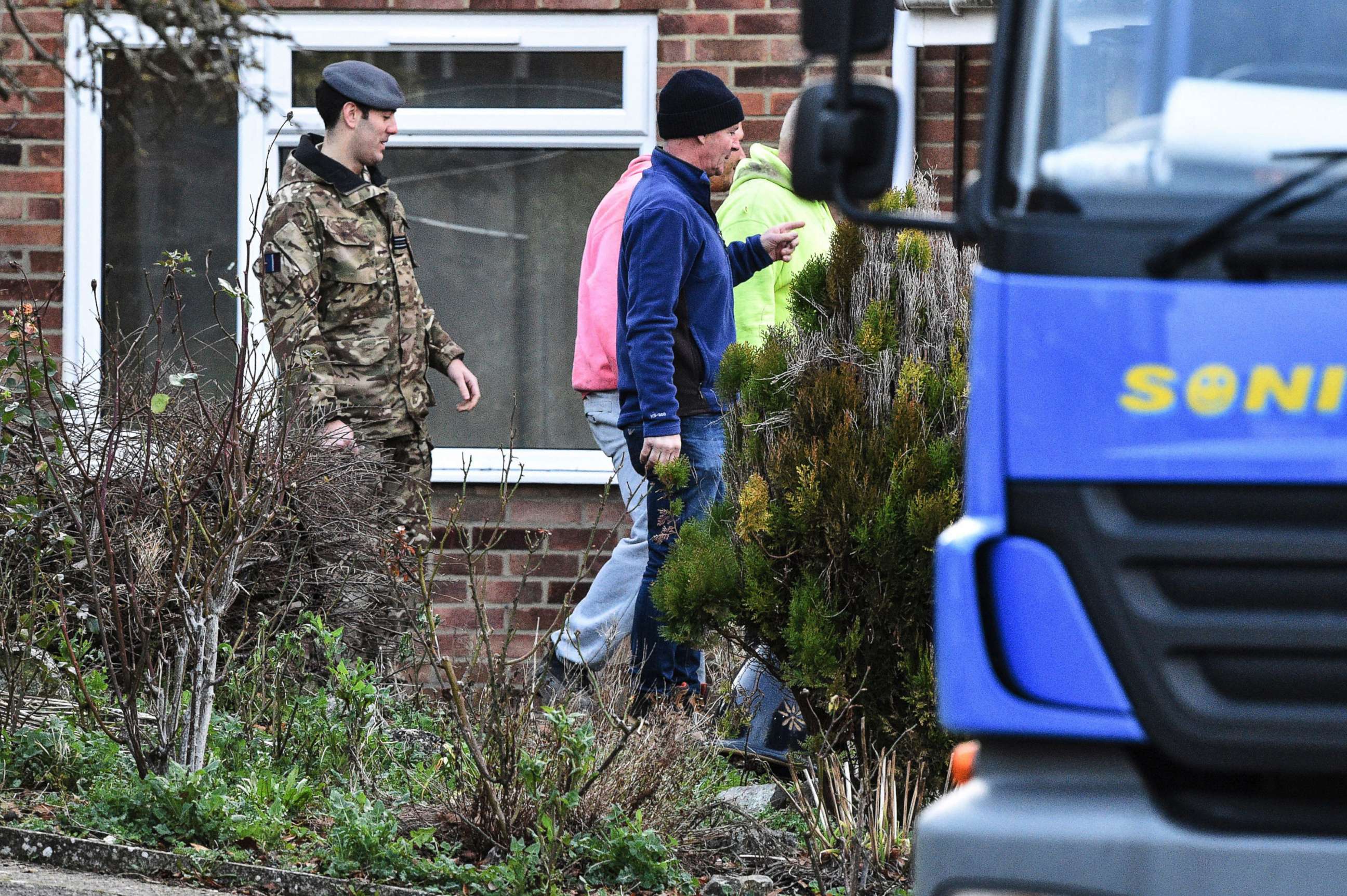 PHOTO: Contractors and military personnel seen outside the home of former Russian spy Sergei Skripal in Salisbury, England, as scaffolding is delivered, Jan. 8, 2019.
