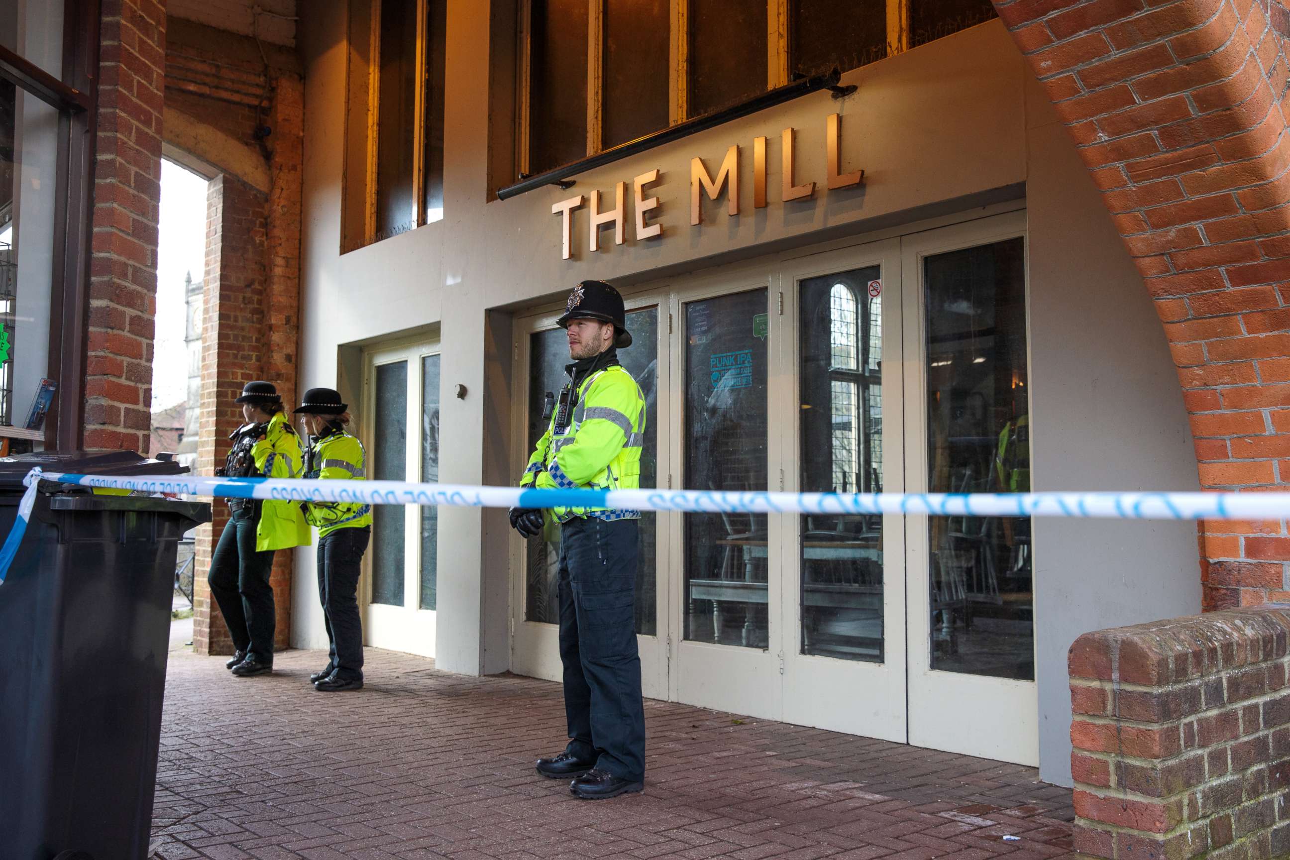 PHOTO: Police officers stand by the cordon outside The Mill pub as investigations continue into the poisoning of Sergei Skripal, March 13, 2018 in Salisbury, England. 