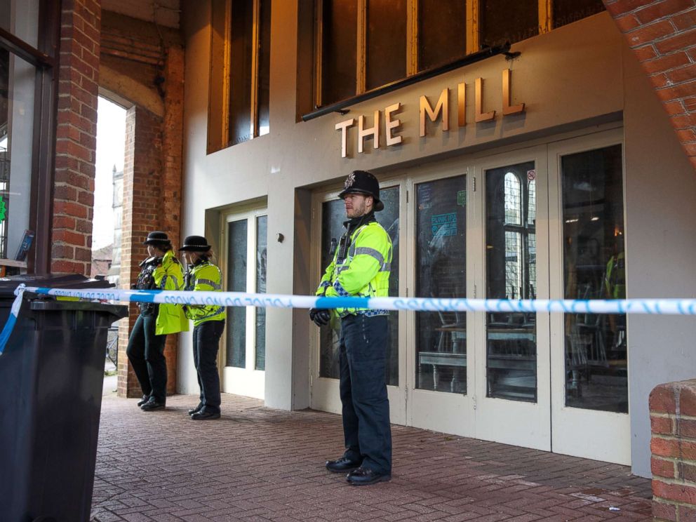 PHOTO: Police officers stand by the cordon outside The Mill pub as investigations continue into the poisoning of Sergei Skripal, March 13, 2018 in Salisbury, England.