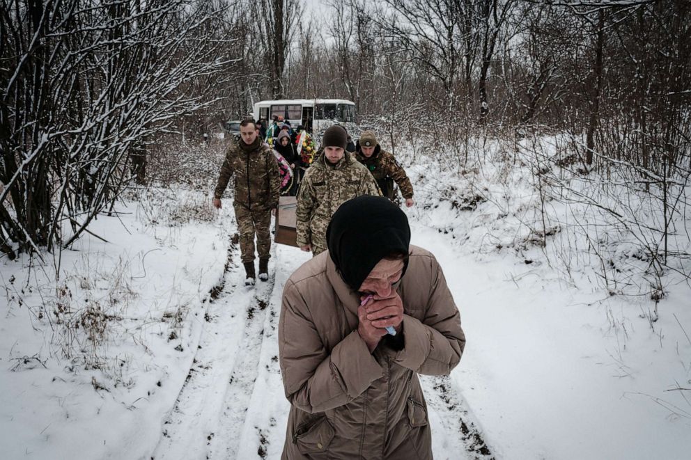 PHOTO: Natalia Shalashnaya, 52, who was a legal guardian of the late Ukrainian serviceman of the Azov battalion, Oleksandr Korovniy, 28, who was killed in action in Bakhmut, mourns as she attends a funeral procession in Sloviansk, on Jan. 30, 2023.