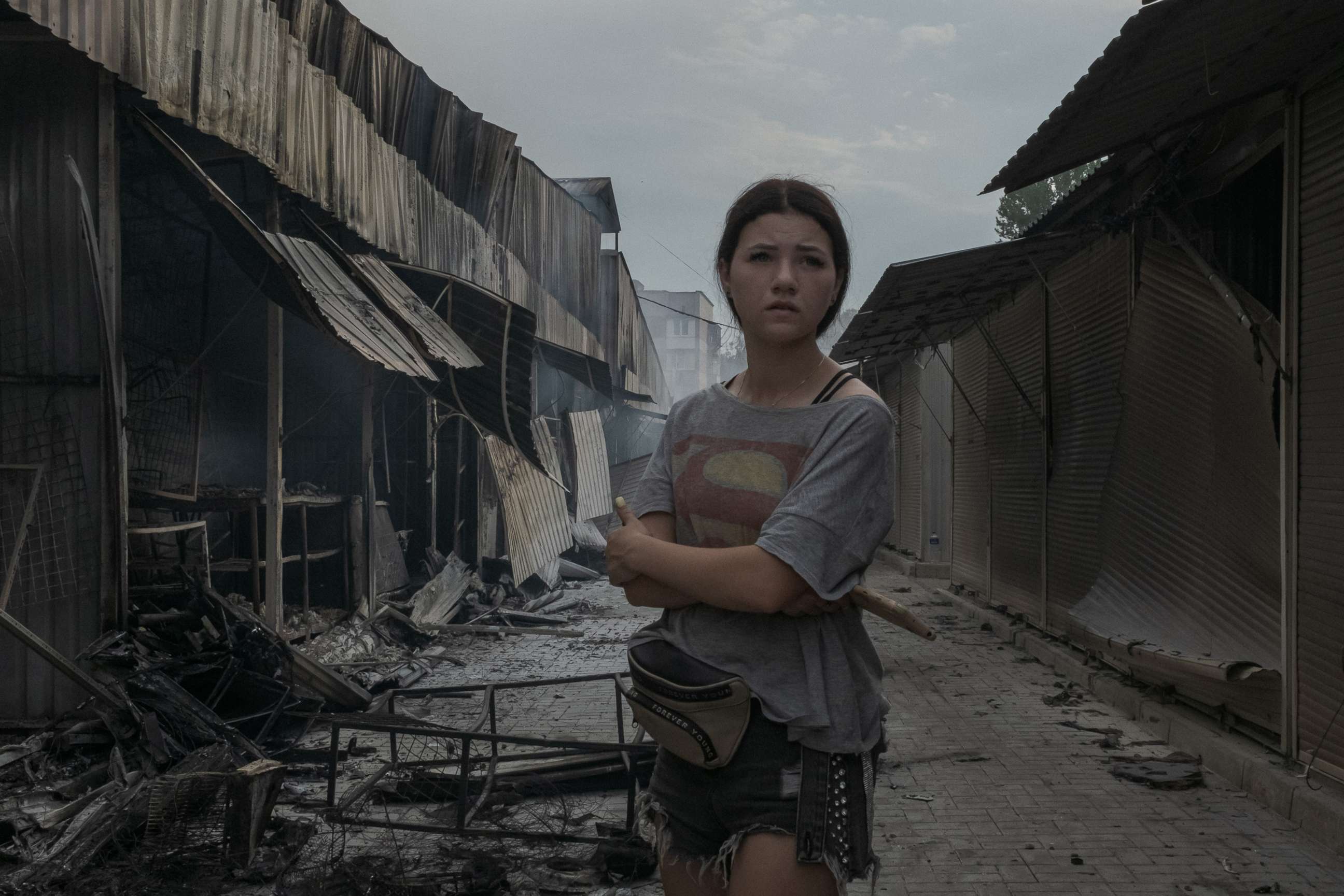 PHOTO: A young resident surveys the damage caused by rocket strikes on the main market in Sloviansk, Ukraine, July 5, 2022.