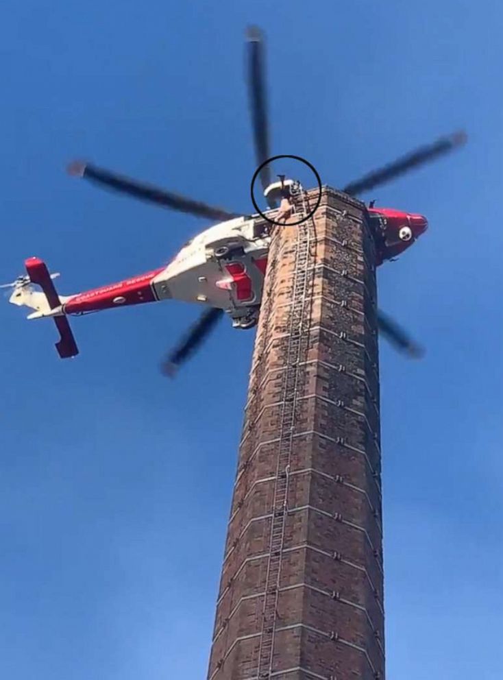 Rescue operation underway to free man stuck on top of 290-foot tall ...