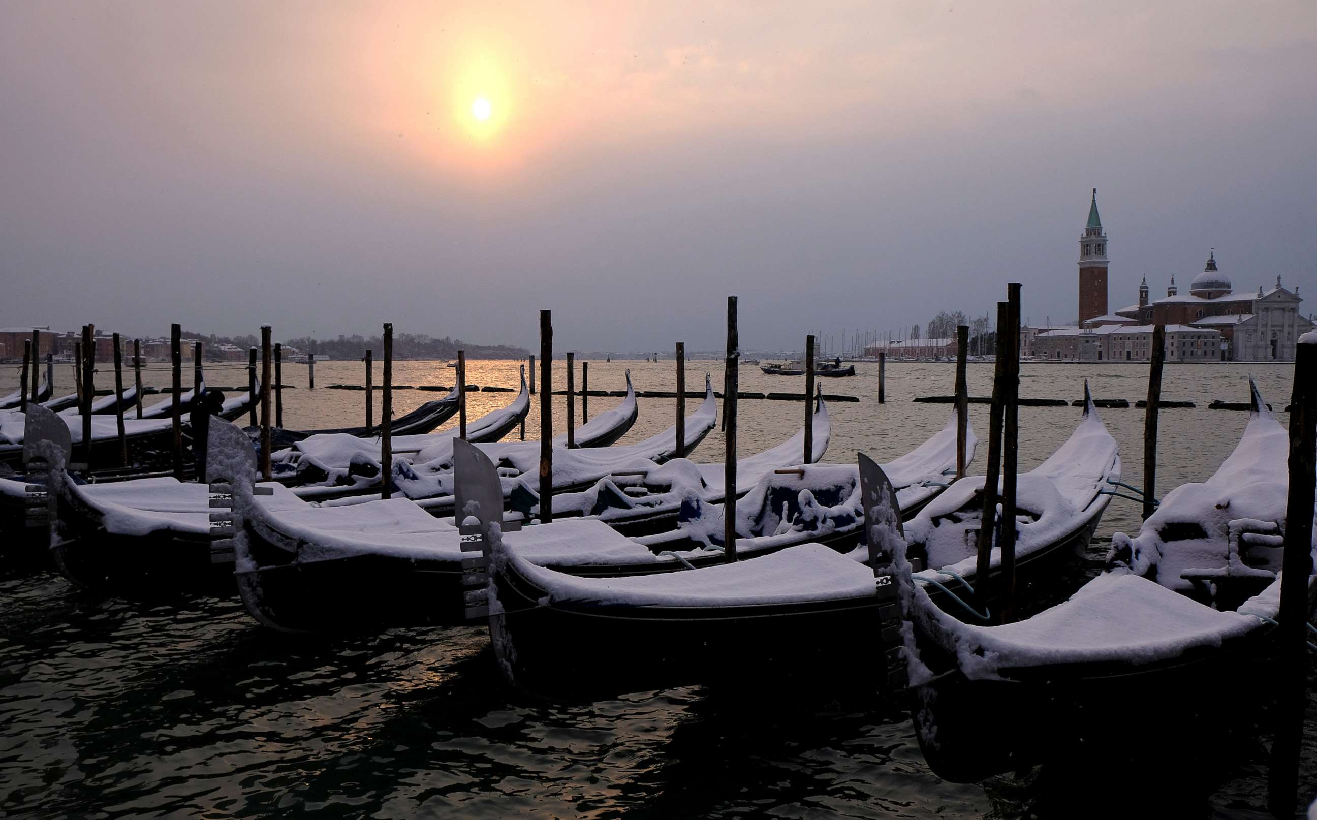 PHOTO: Snow covered gondola's are seen near St.Mark square in Venice lagoon, Italy, Feb. 28, 2018.