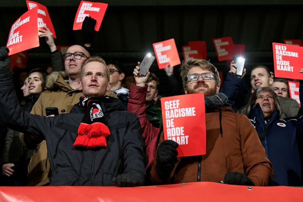 PHOTO: SBV Excelsior fans hold cards reading ""Give racism the red card" during a symbolic protest called "Racism? Then we don't play football" by all the Dutch soccer team players intending to only play 89 minutes of soccer in the first division.