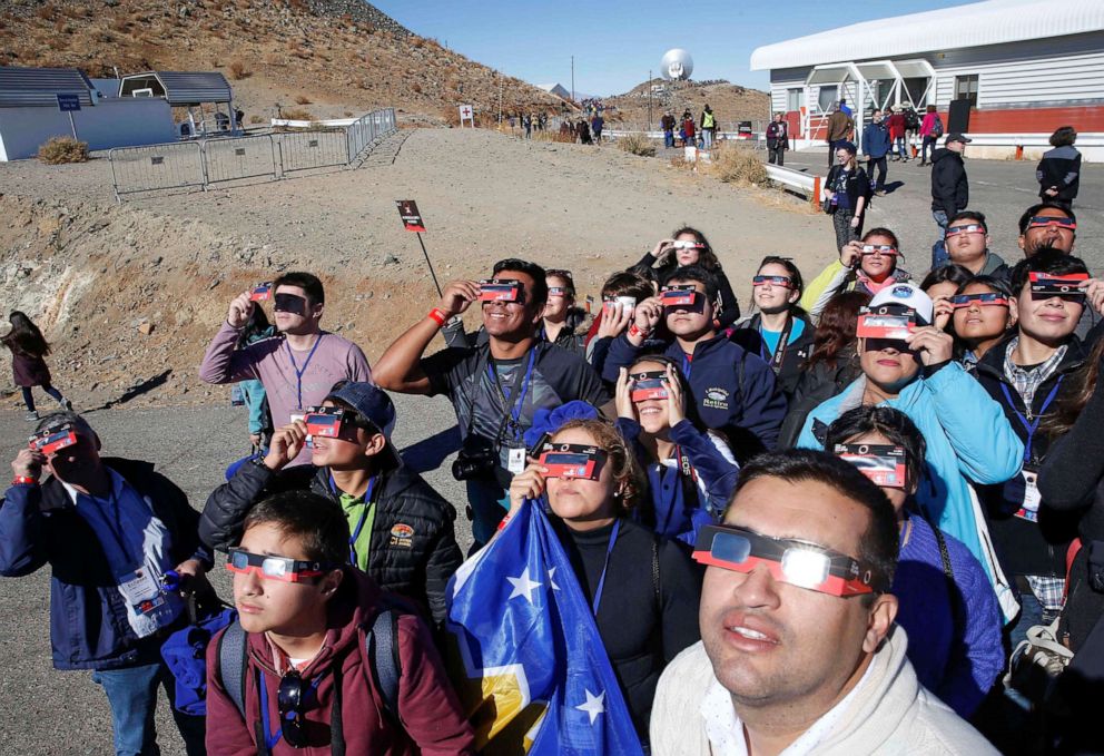 PHOTO: People test their special solar glasses before the solar eclipse in La Silla European Southern Observatory at Coquimbo, Chile, July 2, 2019.
