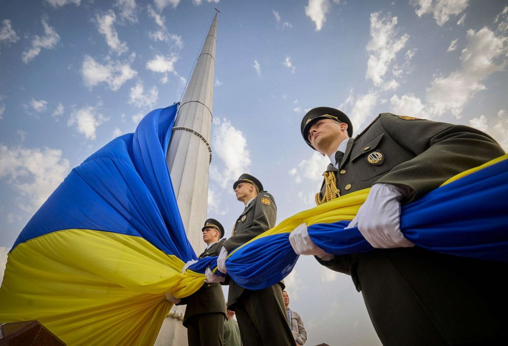 PHOTO: In this photo provided by the Ukrainian Presidential Press Office, honour guard soldiers prepare to rise the Ukrainian national flag during State Flag Day celebrations in Kyiv, Ukraine, Aug. 23, 2022. 
