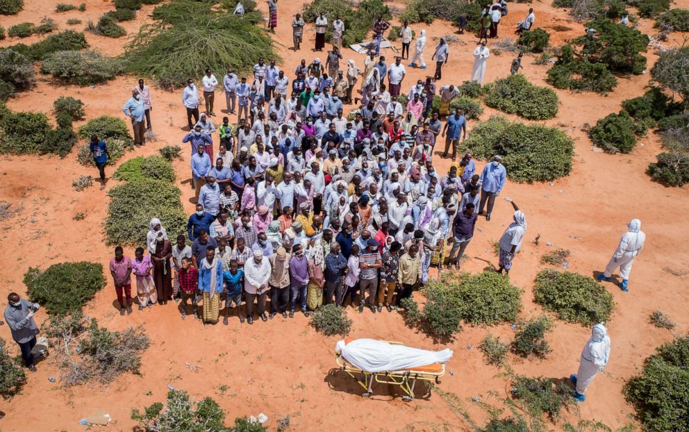 PHOTO: Mourners gather to bury an elderly man believed to have died of the coronavirus in Mogadishu, Somalia, April 30, 2020.