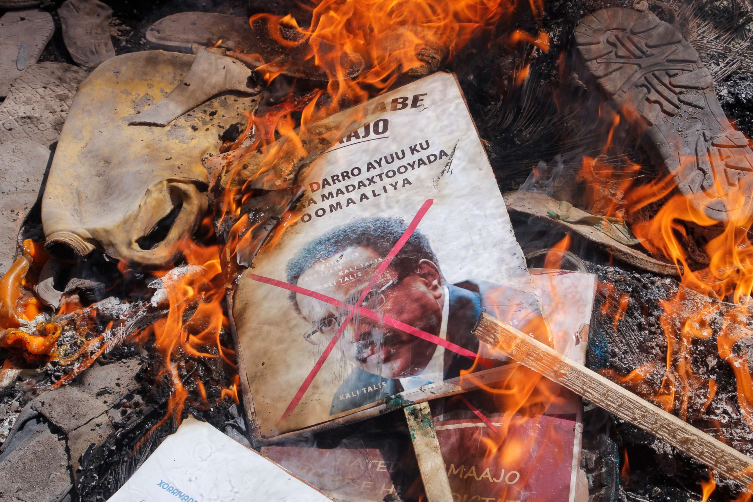 PHOTO: Demonstrators from Somali anti-government opposition groups burn photographs of the president in the Fagah area of Mogadishu, Somalia, on April 25, 2021.