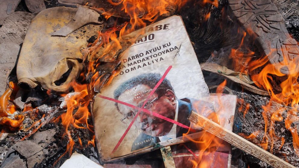PHOTO: Demonstrators from Somali anti-government opposition groups burn photographs of the president in the Fagah area of Mogadishu, Somalia, on April 25, 2021.