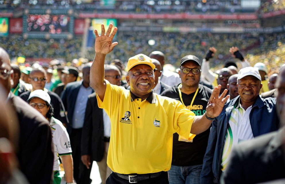 PHOTO:South Africa President Cyril Ramaphosa greets supporters as he arrives for the final election rally of the African National Congress (ANC) at Ellis Park stadium in Johannesburg, May 5, 2019.