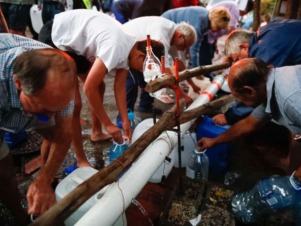 PHOTO: Residents of Cape Town collect drinking water in the early morning from a mountain spring collection point in Cape Town, South Africa, Jan. 31, 2018.