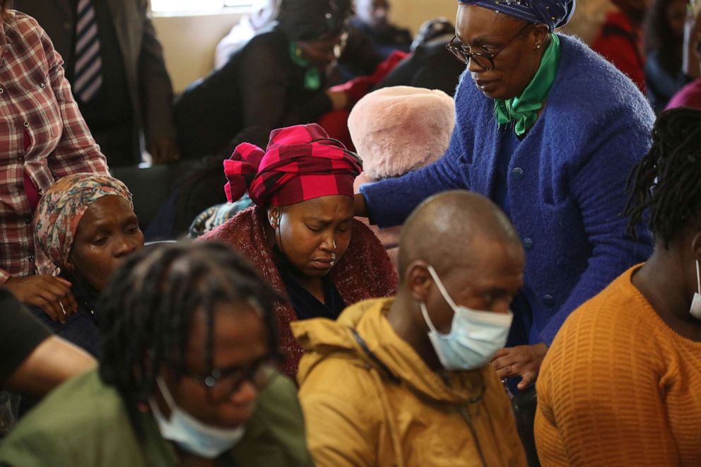 PHOTO: Mourners attend a service at the Assembly of God Church in Scenery Park, East London, South Africa, June 27, 2022. South African authorities are seeking answers after more than 20 teenagers died in a mysterious weekend incident at a nightclub.