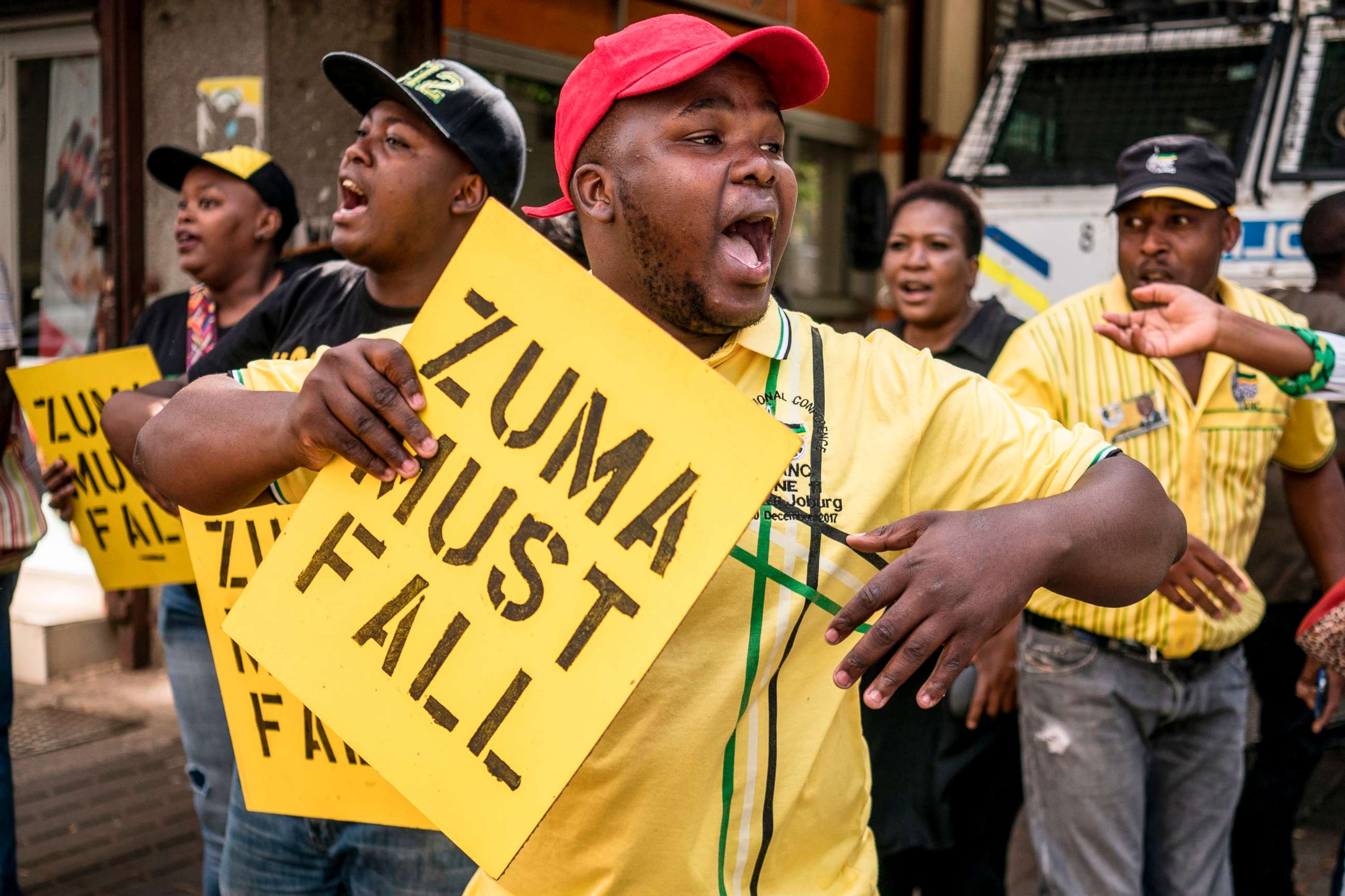 PHOTO: Supporters of the African National Congress Deputy President Cyril Ramaphosa hold placards and chant slogans outside the ANC party headquarters in Johannesburg, Feb. 5, 2018.