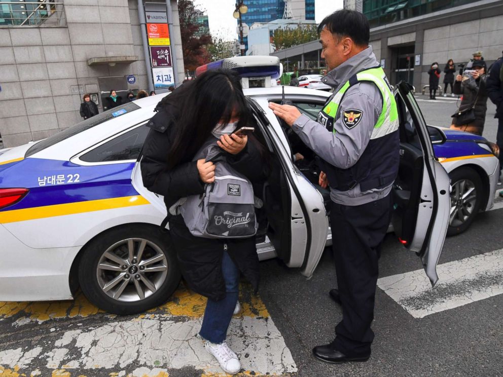 PHOTO: A student gets out of a police car as she arrives to sit the annual College Scholastic Ability Test, a standardized exam for college entrance, at a high school in Seoul on Nov. 23, 2017.