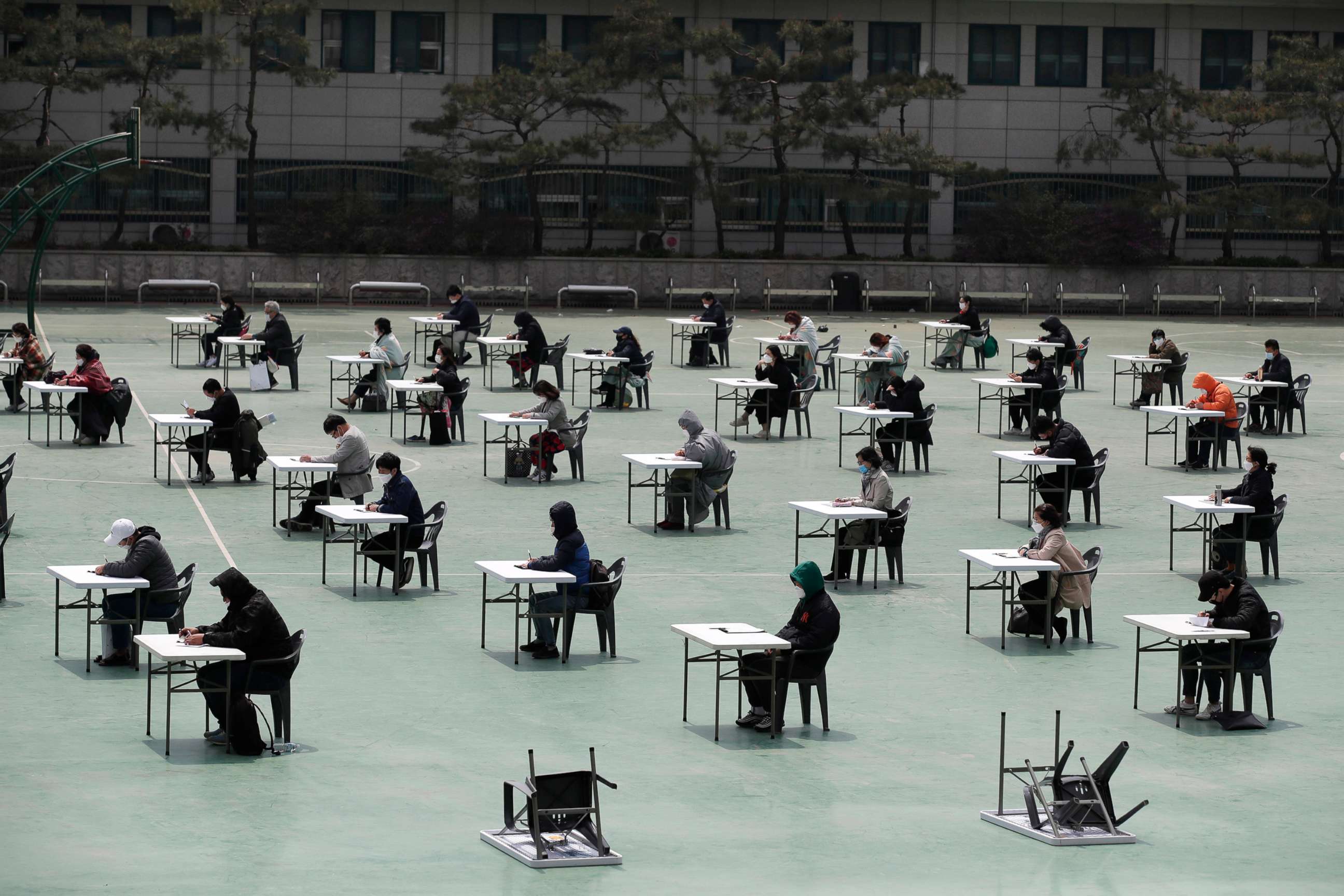 PHOTO: Applicants sit for the written examination during an insurance planner qualification exam in Seoul, South Korea, April 25, 2020.