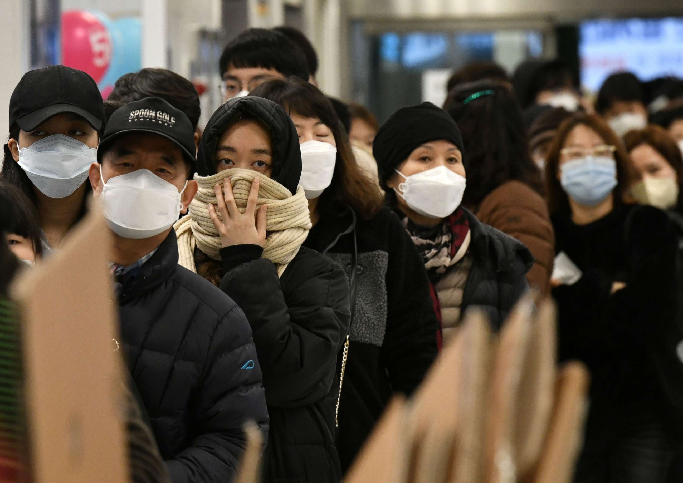 PHOTO: People wait in a line to buy face masks at a retail store in the southeastern city of Daegu on February 25, 2020. 