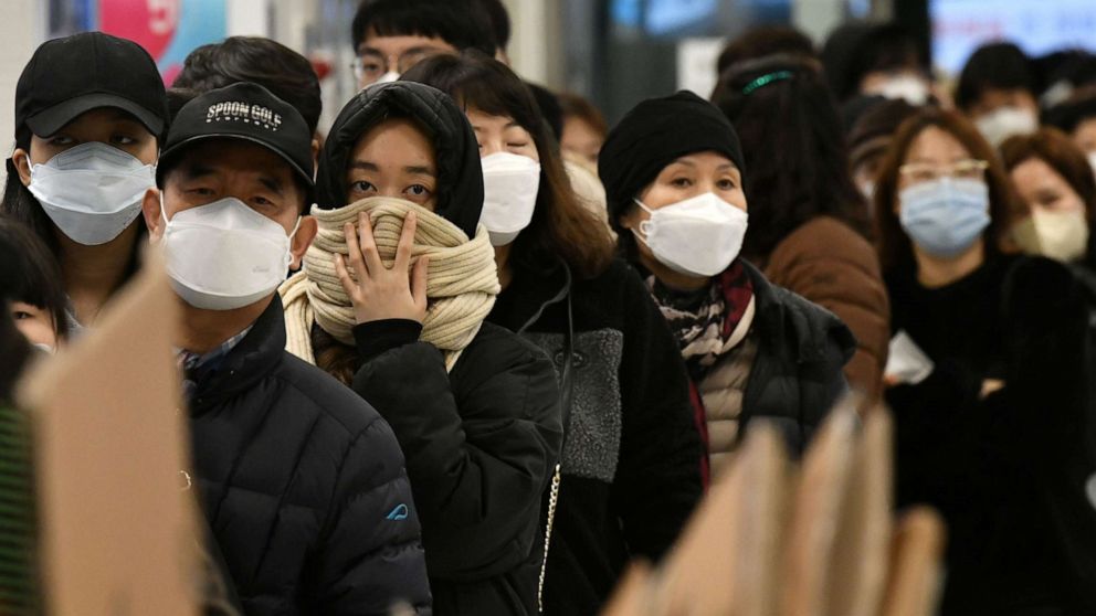 People wait in a line to buy face masks at a retail store in the southeastern city of Daegu on February 25, 2020.Jung Yeon-je/AFP via Getty Images