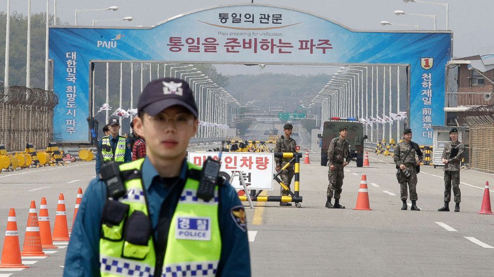 PHOTO: South Korean army soldiers and police officers stand guard at Unification Bridge, which leads to Panmunjom in Paju, South Korea, April 26, 2018.