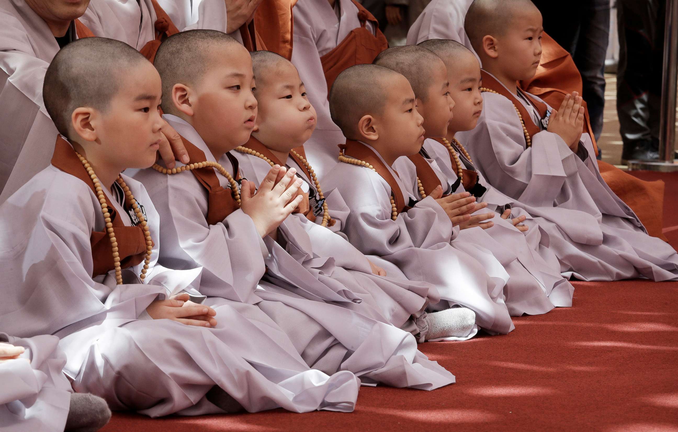 PHOTO: Boys with newly shaved heads sits after a service to celebrate Buddha's upcoming 2,563th birthday on May 12, at the Jogye Temple in Seoul, South Korea, April 22, 2019.