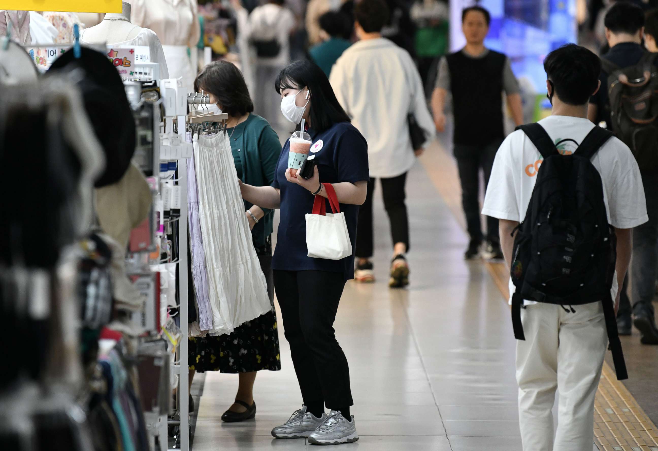 PHOTO: People wearing face masks walk through an underground shopping area in Seoul on May 6, 2020.