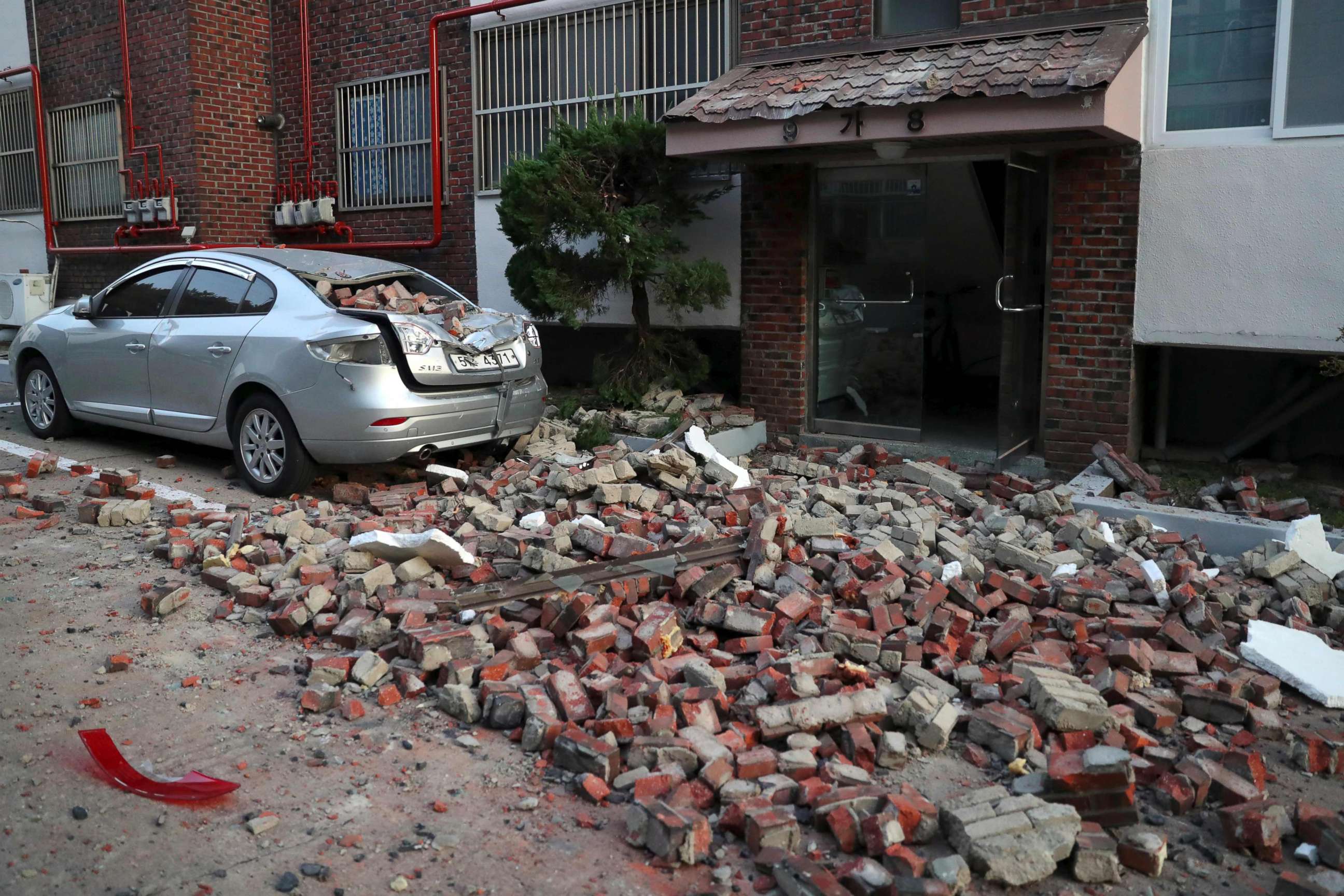 PHOTO: A car damaged by falling bricks after a 5.4-magnitude earthquake is seen in the southeastern port city of Pohang, Nov. 15, 2017.