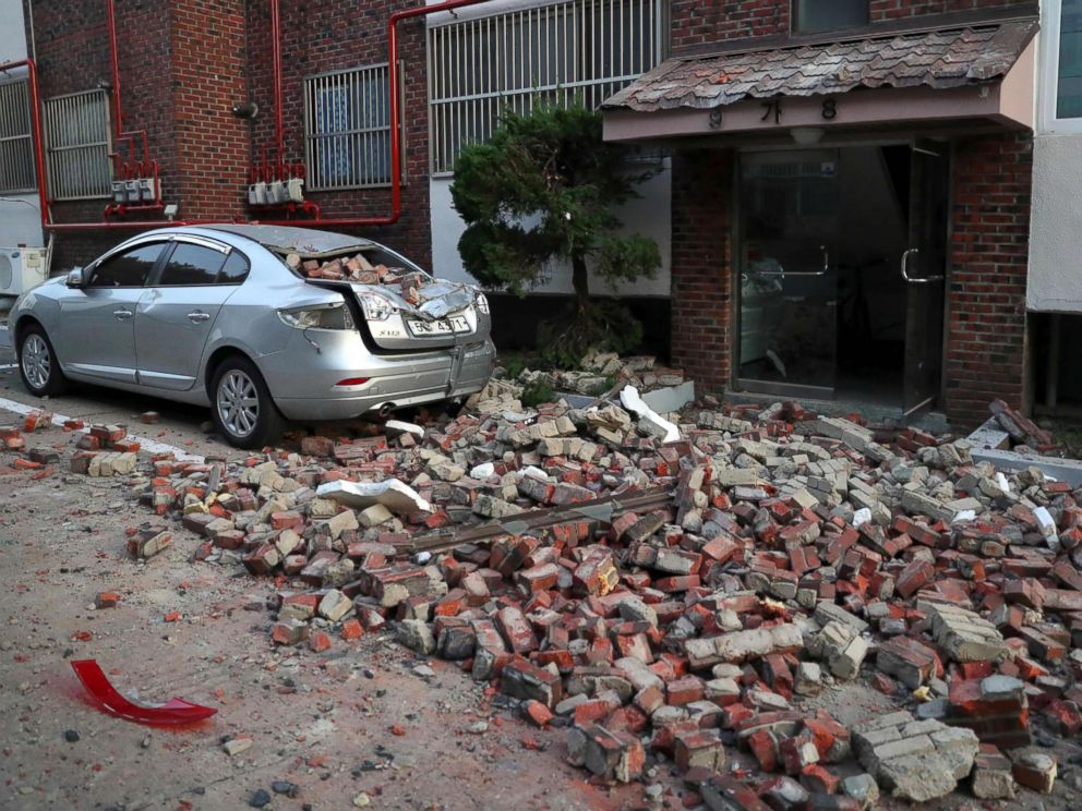 PHOTO: A car damaged by falling bricks after a 5.4-magnitude earthquake is seen in the southeastern port city of Pohang, Nov. 15, 2017.