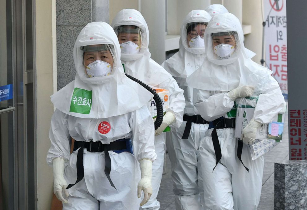 PHOTO: Nurses wearing protective gear arrive for their shift to care for patients infected with the novel coronavirus at Keimyung University Dongsan Hospital in Daegu, South Korea, on April 29, 2020.