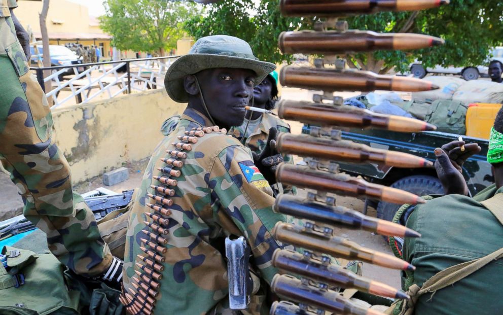 PHOTO: A South Sudanese soldier stands next to a machine gun mounted on a truck in Malakal town, northeast of Juba, South Sudan, Dec. 30, 2013.