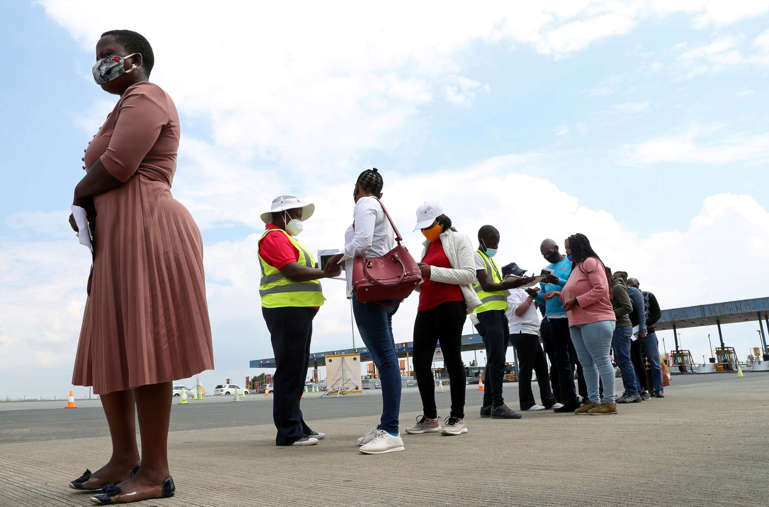 PHOTO:Travelers wait in a queue ahead of testing for the coronavirus disease amid a COVID-19 lockdown, at the Grasmere Toll Plaza, in Lenasia, South Africa on Jan. 14, 2021.