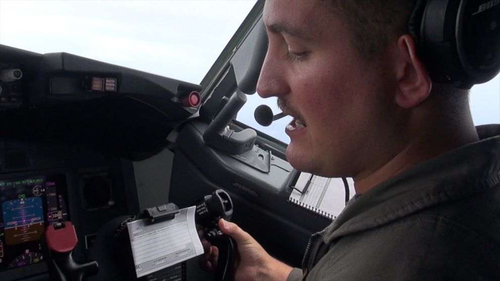 PHOTO: A member of the U.S. Navy Maritime Patrol Squadron Four radios a response to a warning from Chinese personnel, over the South China Sea, on Sep. 6, 2018.