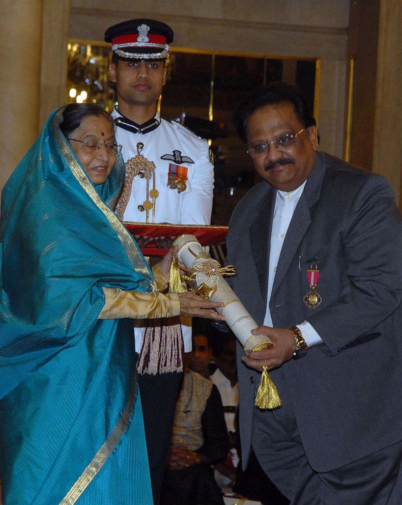 PHOTO: In this file photo taken on March 24, 2011, Indian President Pradibha Singh Patil (left) presents an award to famed playback singer SP Balasubrahmanyam during the the 2011 Padma Awards at the presidential house in New Delhi.