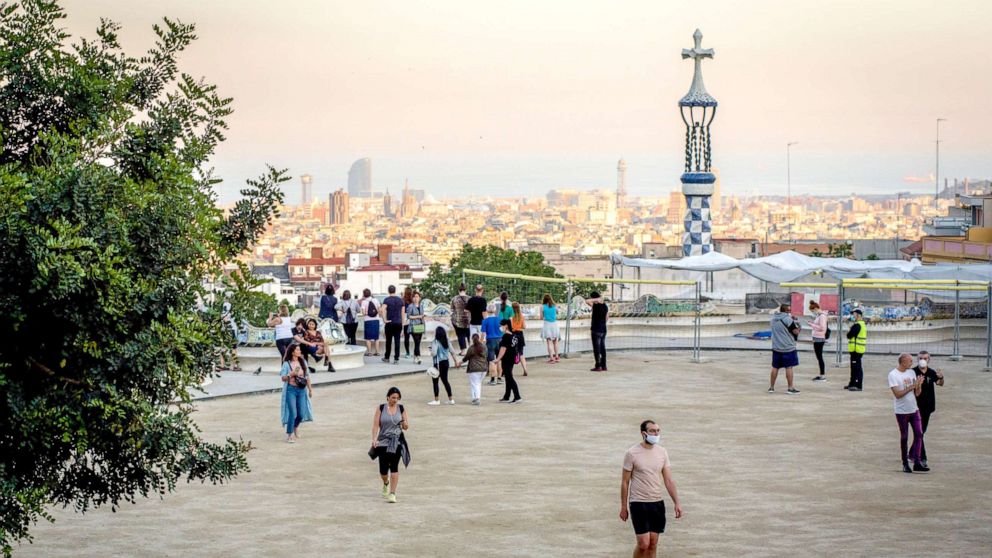 PHOTO: People in Barcelona visit the Guell Park on May 20, 2020.