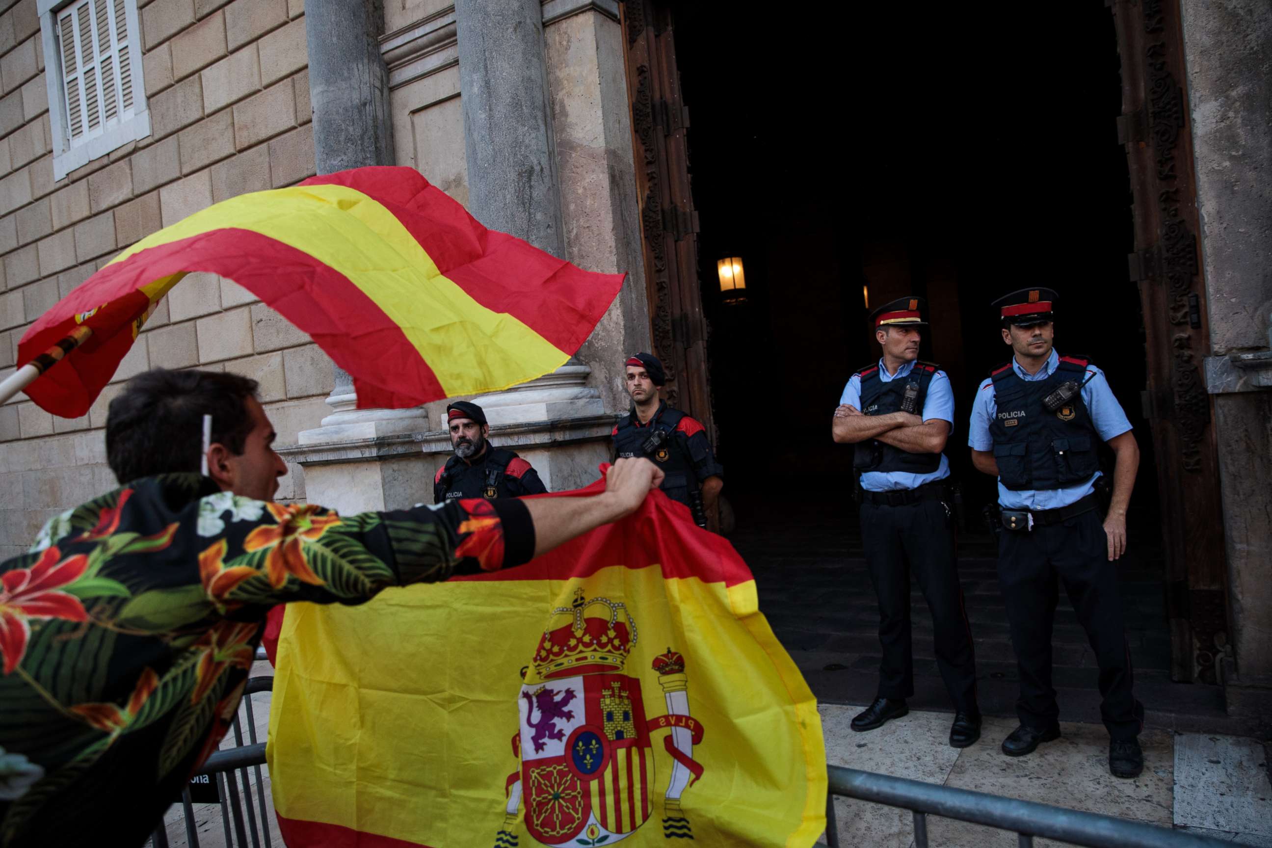 PHOTO: Nationalist supporters gesture at police outside the Catalan Government building, the Palau de la Generalitat following a pro-unity protest on Oct. 29, 2017 in Barcelona, Spain.
