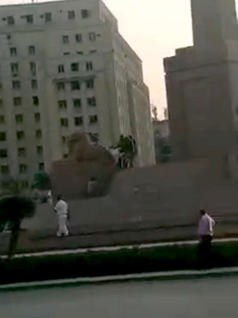 PHOTO: A man attempted to demolish one of four ancient sphinxes adorning the Tahrir square in Cairo before being caught by security personnel, Oct. 19, 2021.