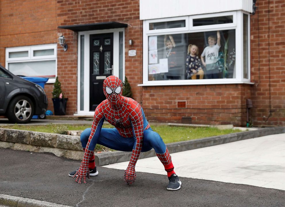 PHOTO: Jason Baird dresses as Spiderman for his daily exercise to cheer up local children in Stockport, as the spread of the coronavirus disease (COVID-19) continues, Stockport, Britain, April 1, 2020.