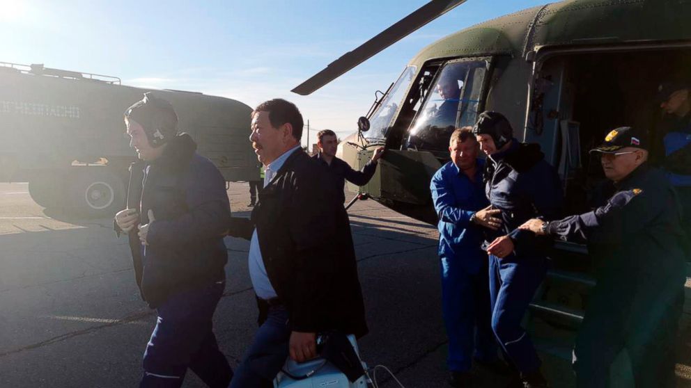 PHOTO: In this photo provided by Russian Defense Ministry Press Service, Russian cosmonaut Alexey Ovchinin, left, and NASA astronaut Nick Hague, second from right, are evacuated by the rescue team after an emergency landing, Oct. 11, 2018. 