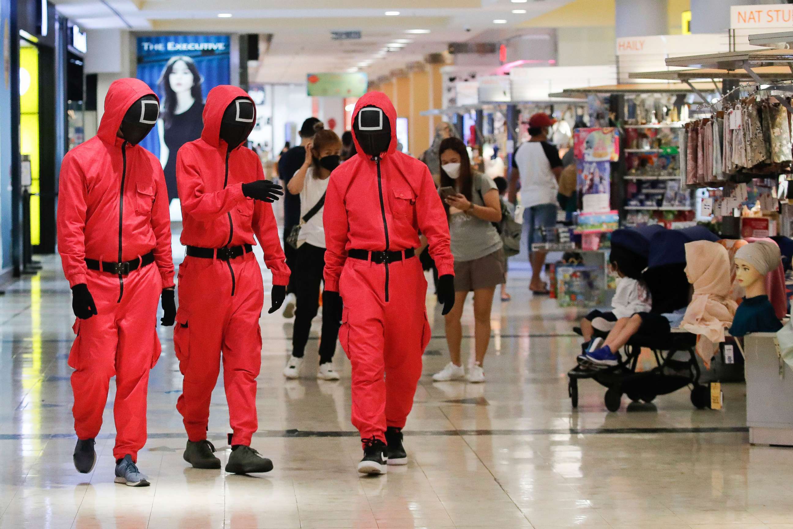 PHOTO: Pink officers from Squid Game walk inside Sunway Pyramid shopping mall in Subang, outside Kuala Lumpur in Malaysia, Oct. 20, 2021.