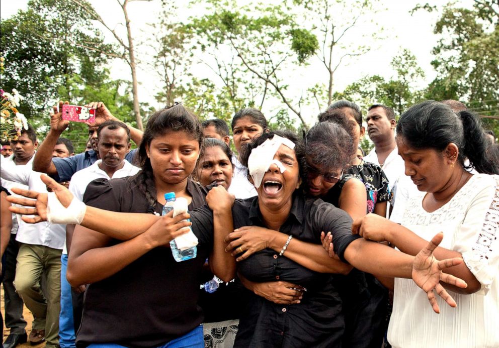 PHOTO: Anusha Kumari weeps during a mass burial for her husband, two children and three siblings, all victims of Easter Sunday bomb blast in Negombo, Sri Lanka, April 24, 2019.