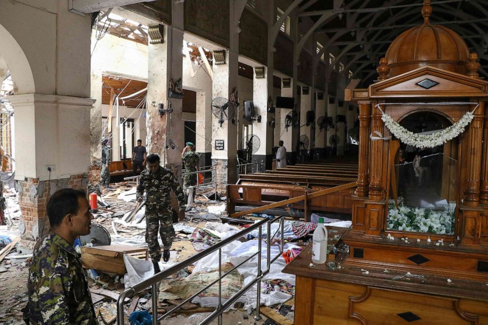  Sri Lankan security personnel survey damage at St. Anthony's Shrine following an explosion in Colombo, Sri Lanka, April 21, 2019.
     