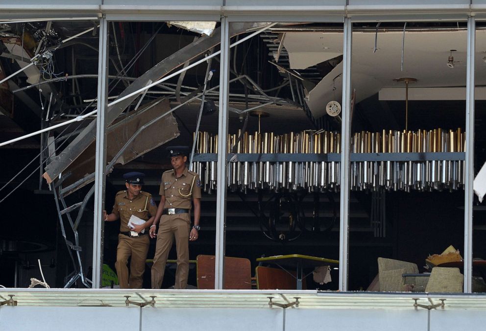 PHOTO: Sri Lankan police stand at the site of an explosion in a restaurant area of the luxury Shangri-La Hotel in Colombo, Sri Lanka, April 21, 2019. 