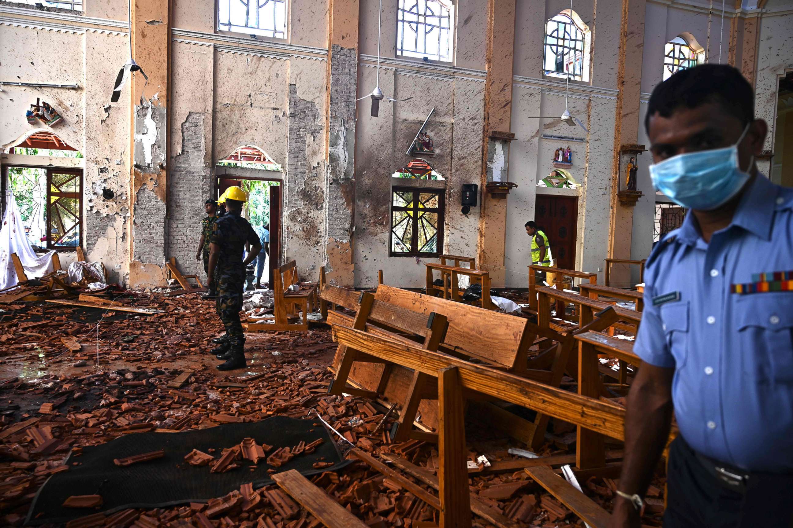 PHOTO: Security personnel inspect the interior of St Sebastian's Church in Negombo on April 22, 2019, a day after the church was hit in series of bomb blasts targeting churches and luxury hotels in Sri Lanka.