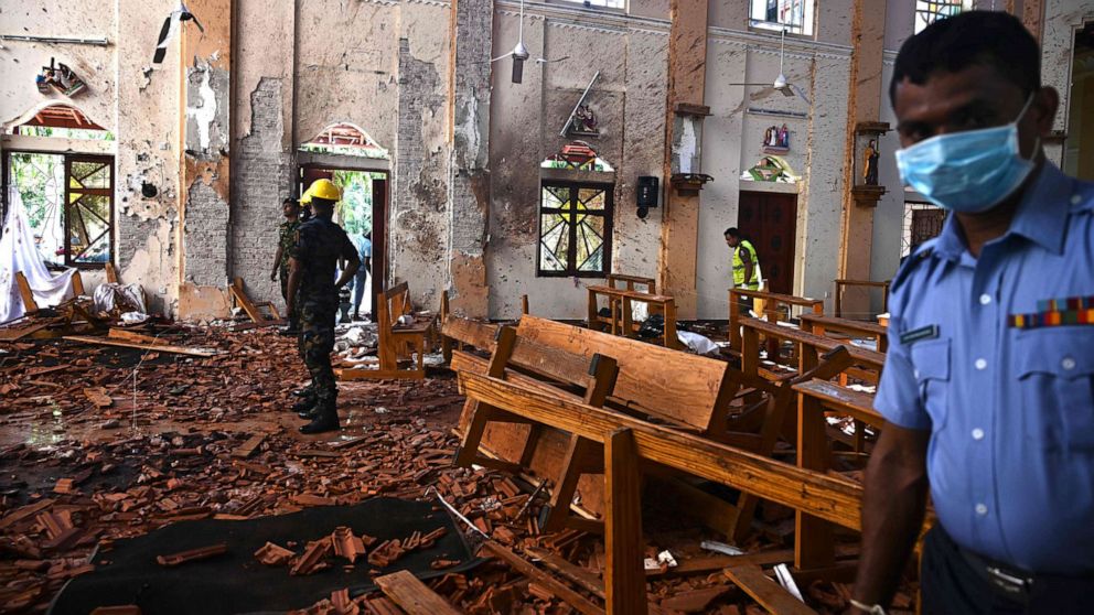 PHOTO: Security personnel inspect the interior of St Sebastian's Church in Negombo on April 22, 2019, a day after the church was hit in series of bomb blasts targeting churches and luxury hotels in Sri Lanka.