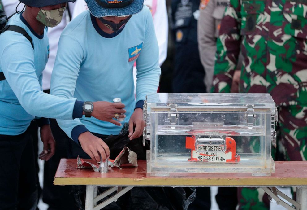 PHOTO: Indonesian Navy personnel arrange parts of the flight data recorder of Sriwijaya Air Flight 182, retrieved from the Java Sea where the jet crashed, during a press conference at the Port of Tanjung Priok in Jakarta, Indonesia, on Jan. 12, 2021.