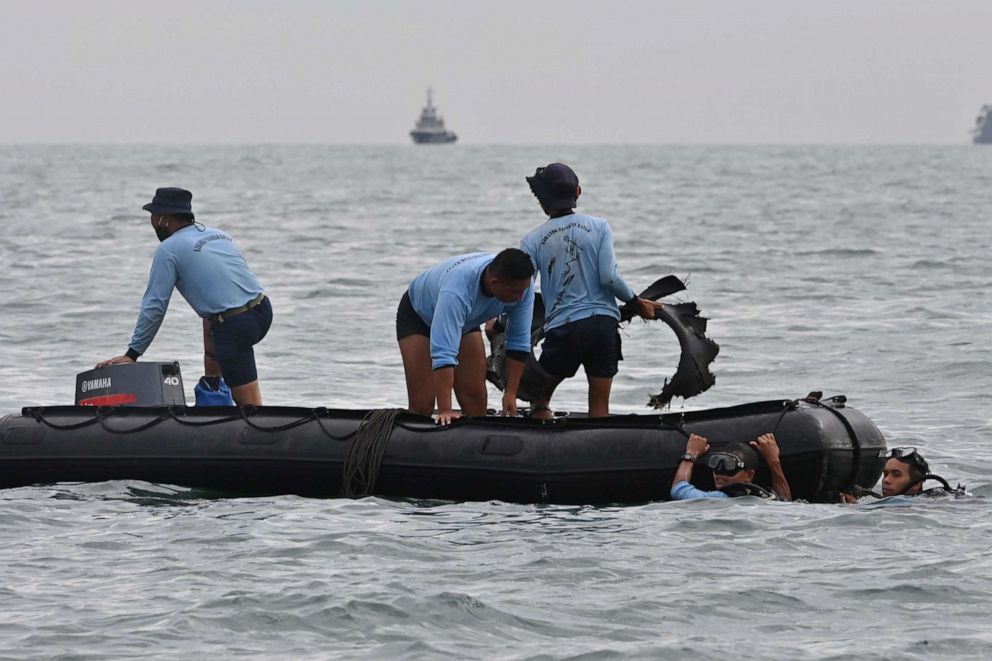 PHOTO: Indonesian Navy divers locate debris in the Java Sea near Lancang island, off the shores north of Jakarta, during search operations for a Sriwijaya Air passenger jet on Jan. 10, 2021.